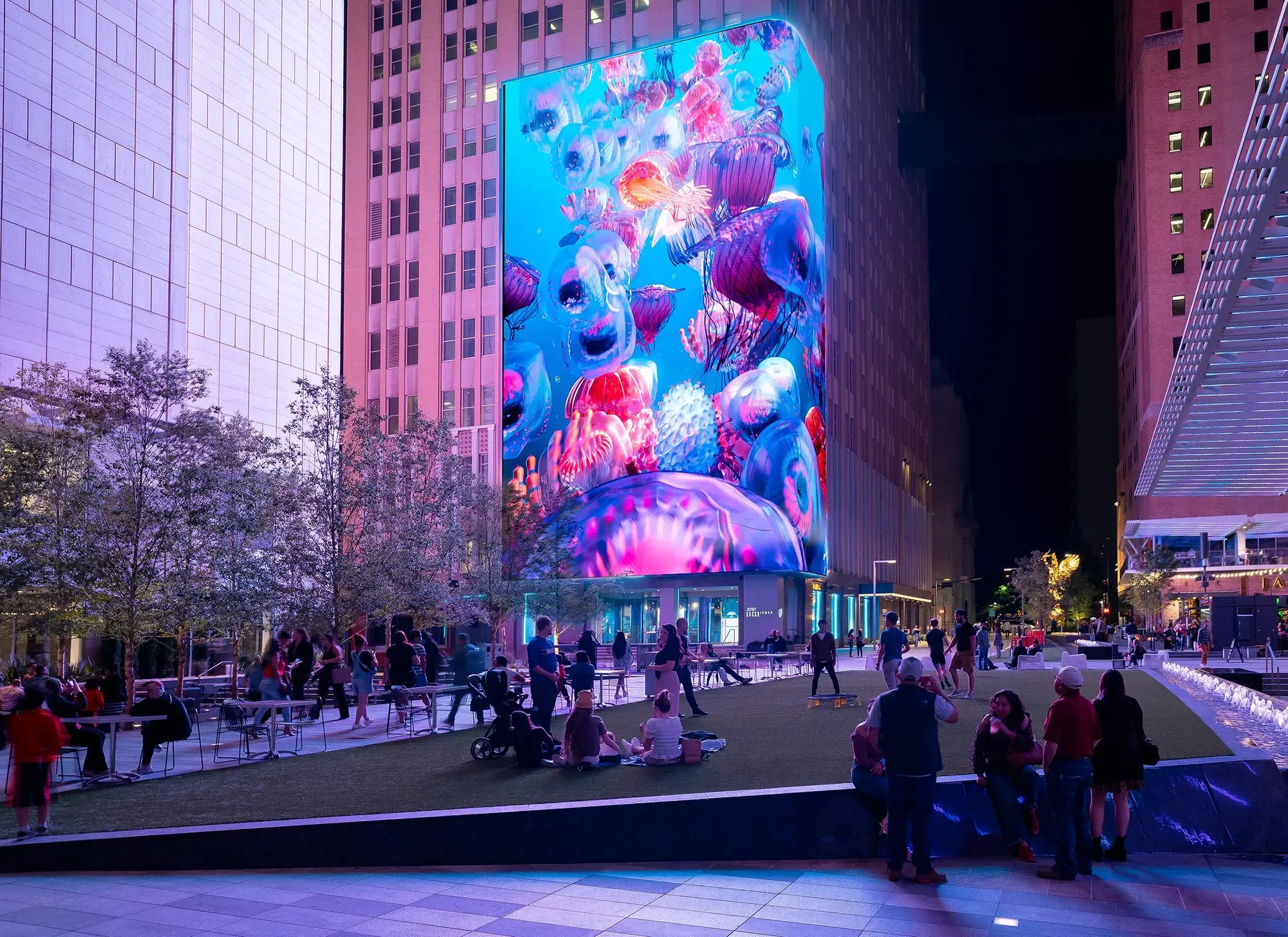 A large-scale digital LED display in a mixed-use space provides visitors with an incredible medium for entertainment in Downtown Dallas.