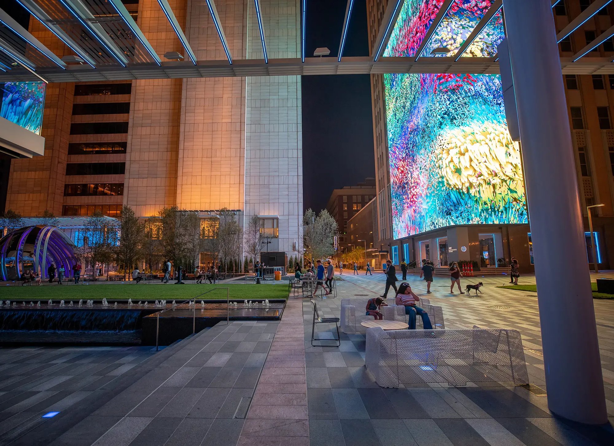 A 3D rendering of the AT&T Discovery District in Downtown Dallas. The AT&T Discovery District is a large communal space equiped with performance audio as well as two large installations, a massive video wall and a rotating immersive globe experience.