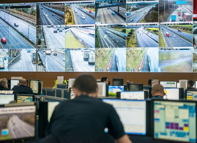 Employees monitoring traffic and potential accidents within one of the UK's premier monitoring facilities.