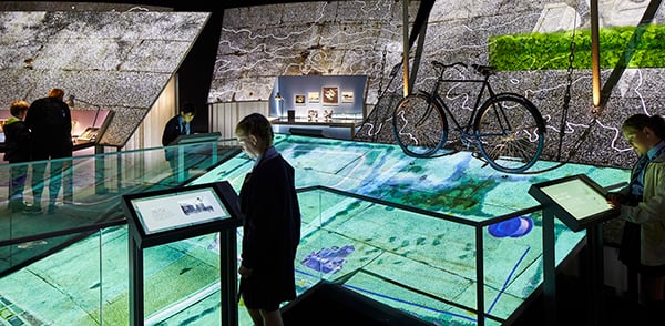 A guest interacting with a touchscreen at Jodrell Bank. 