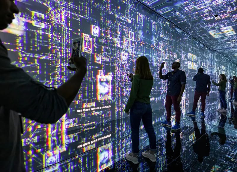 Visitors to the International Spy Museum interacting with the immersive augmented reality experience in the infinity room.