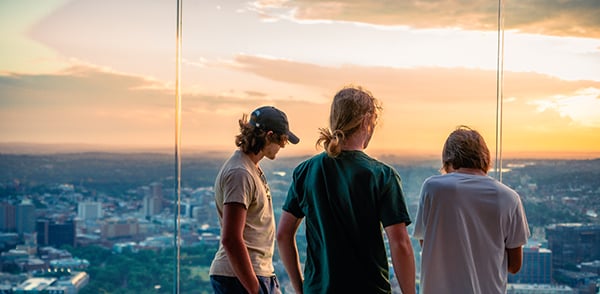 Guests to View Boston looking out at the skyline. 