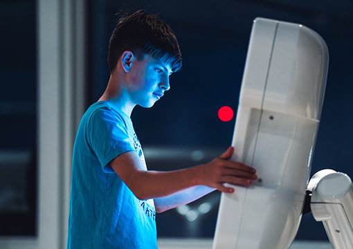 Guest interacting with the interactive viewer at View Boston. 