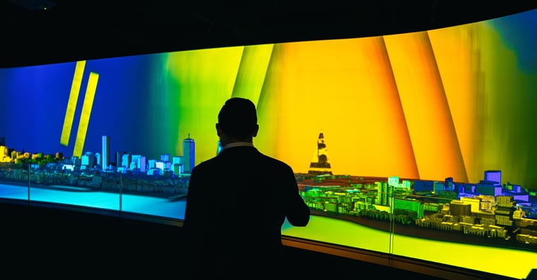 Guest walking through one of the projection exhibits at View Boston. 