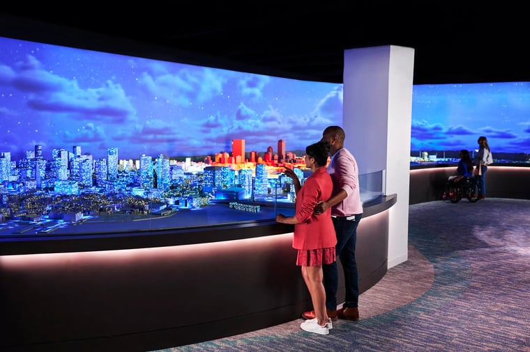Guests watching the Boston 365 projection mapped miniature city experience. 