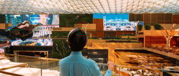 An MGM team member observes The Spectacle’s immersive environment from a balcony, highlighting the scale and complexity of the digital installation.